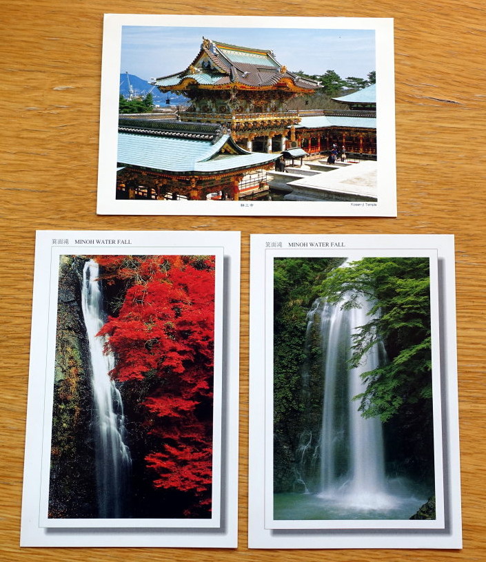 Three postcards two are depicting waterfall and one a Japanese building.