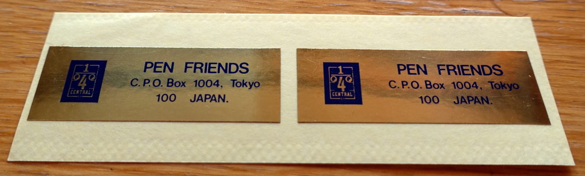 Two golden stickers with Pen Friends club address.